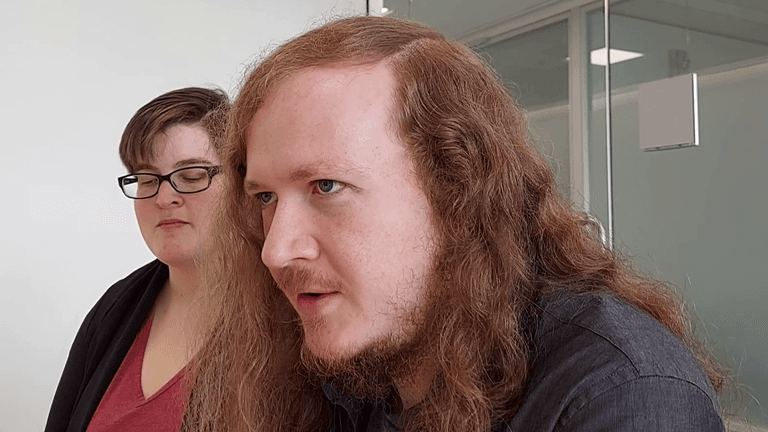 Austin Henrie at work with a colleague